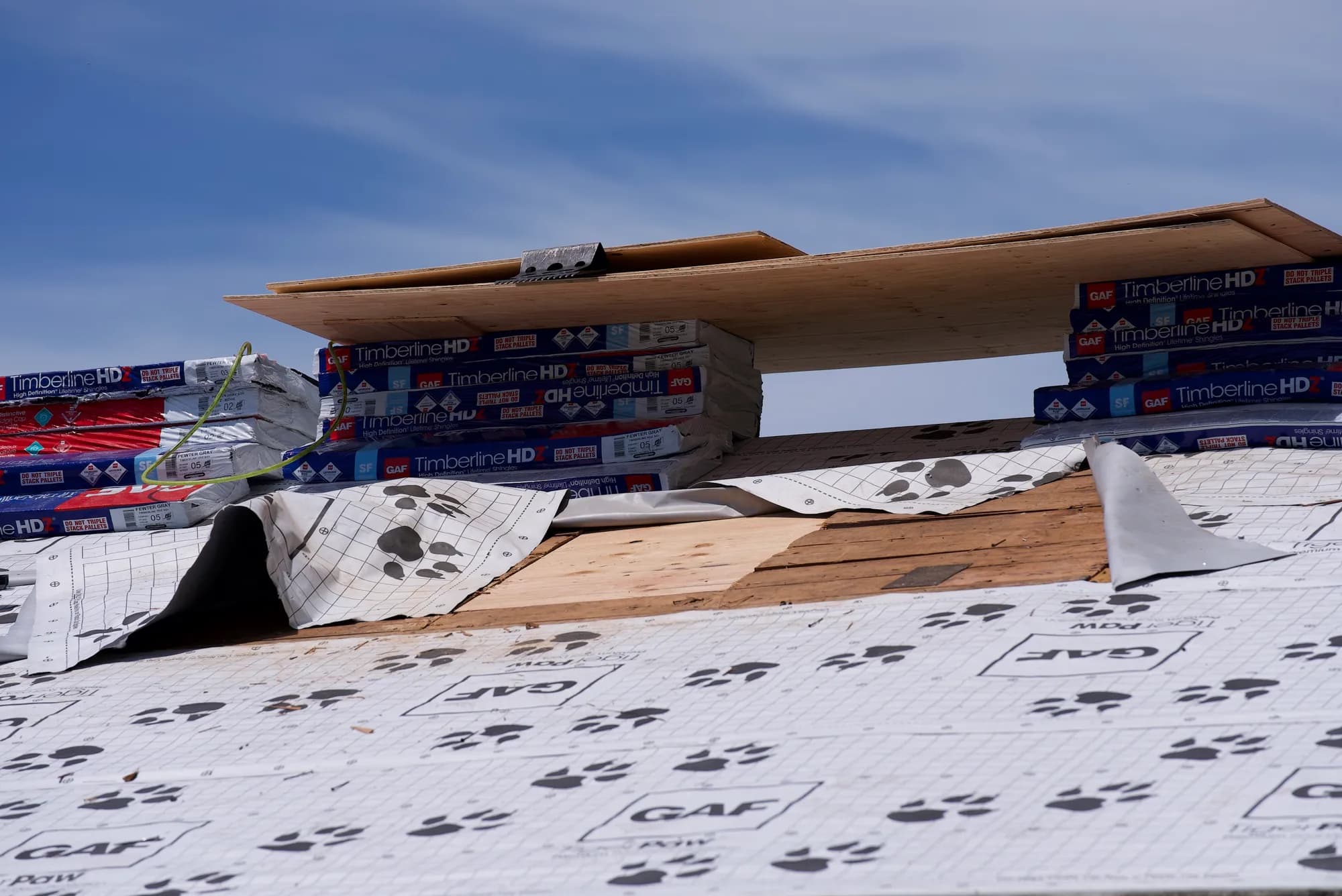 GAF Tiger Paw underlayment peeled back to expose plywood roof sheathing in Hillsboro, OR